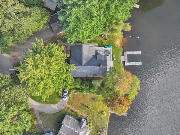 a picture of a bench in front of a wall