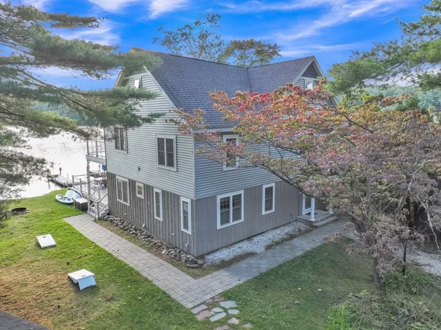 a aerial view of a house with a yard