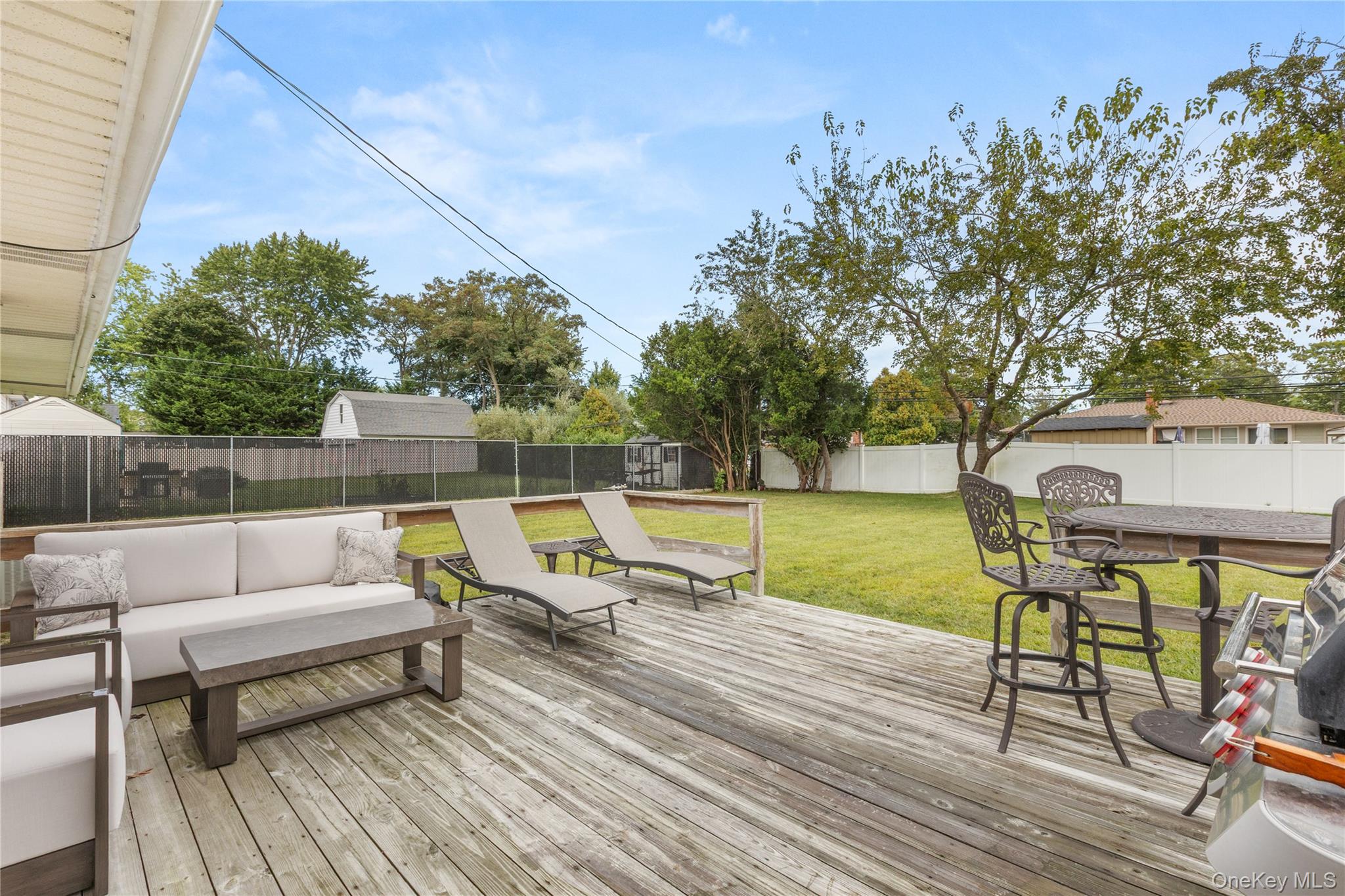 205 Timber Point Road East Islip, NY 11730 - Photo 14 of 16 Deck featuring a fenced backyard and an outdoor hangout area