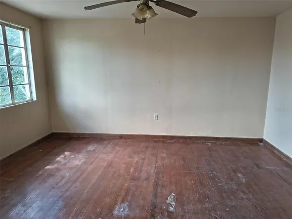 an empty room with a hardwood