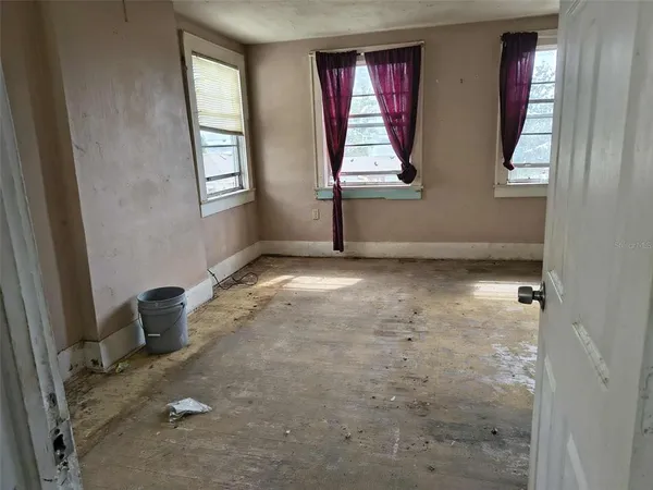 an empty room that has a window