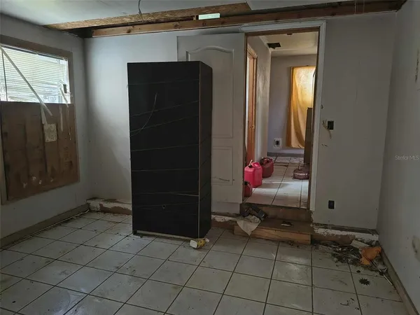 a view of a closet area with wooden floor
