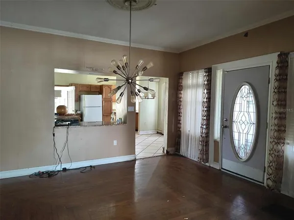 a view of a livingroom with a furniture wooden floor and window