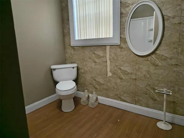 a bathroom with a toilet and a sink