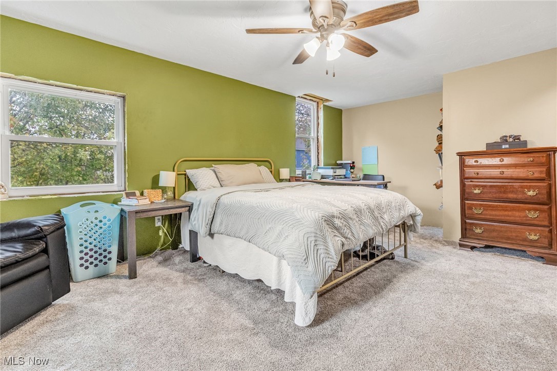 6900 Lake Road Medina, OH 44215 - Photo 17 of 49 Bedroom featuring carpet flooring and a ceiling fan