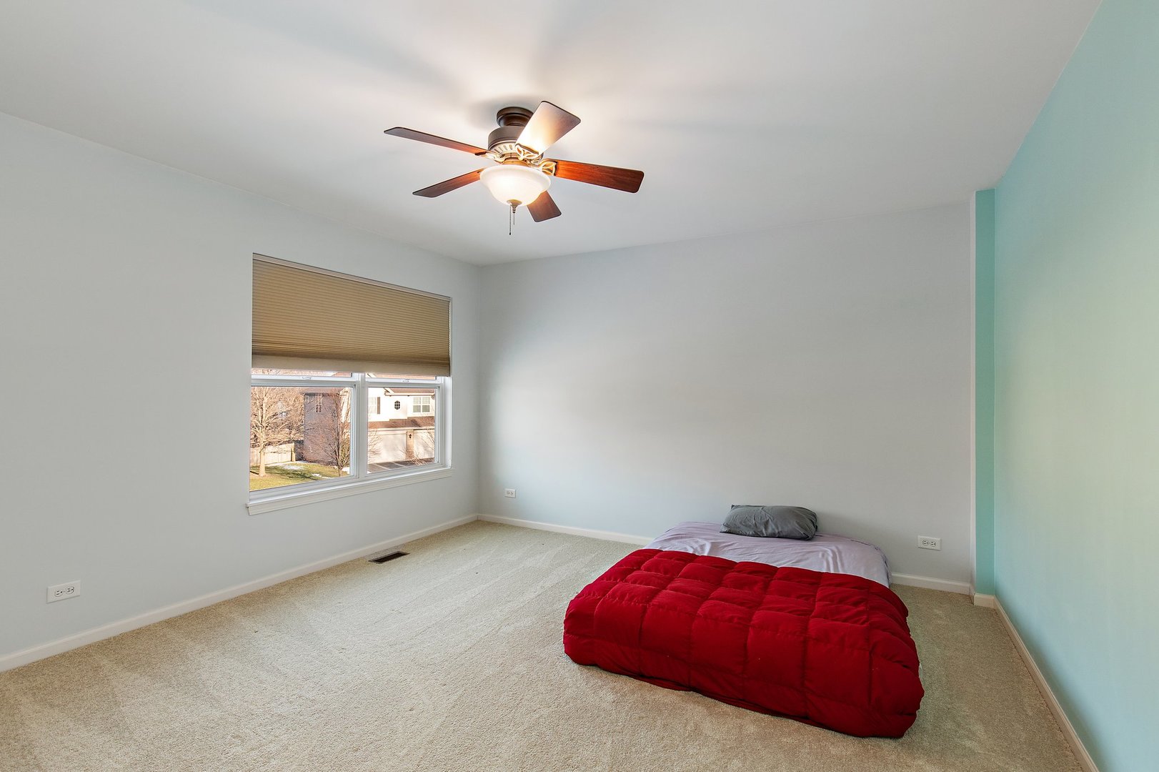 5617 Red Oak Drive Hoffman Estates, IL 60192 - Photo 17 of 30 an empty room with windows and fan