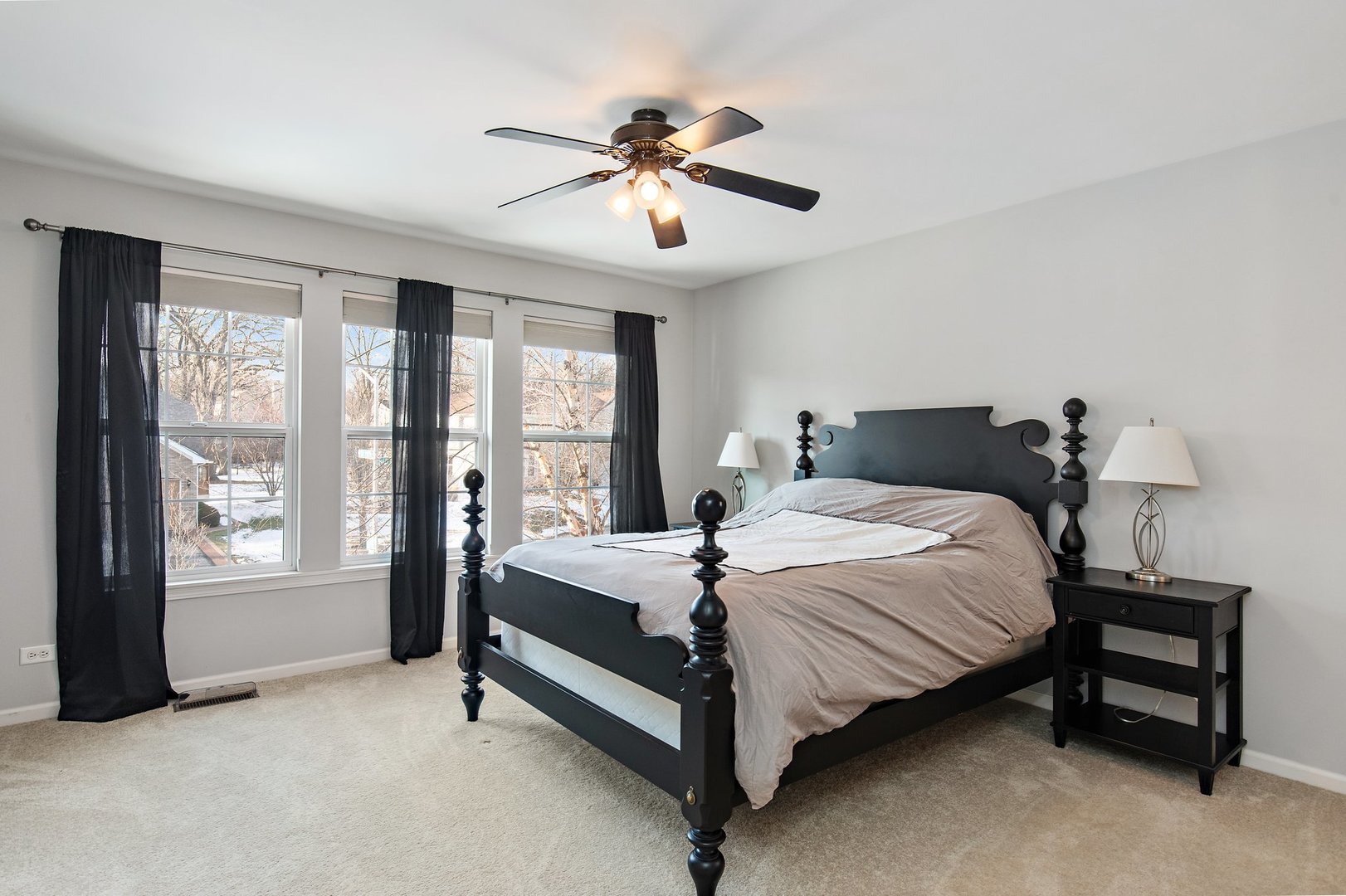 5617 Red Oak Drive Hoffman Estates, IL 60192 - Photo 19 of 30 a bedroom with a bed and a chandelier