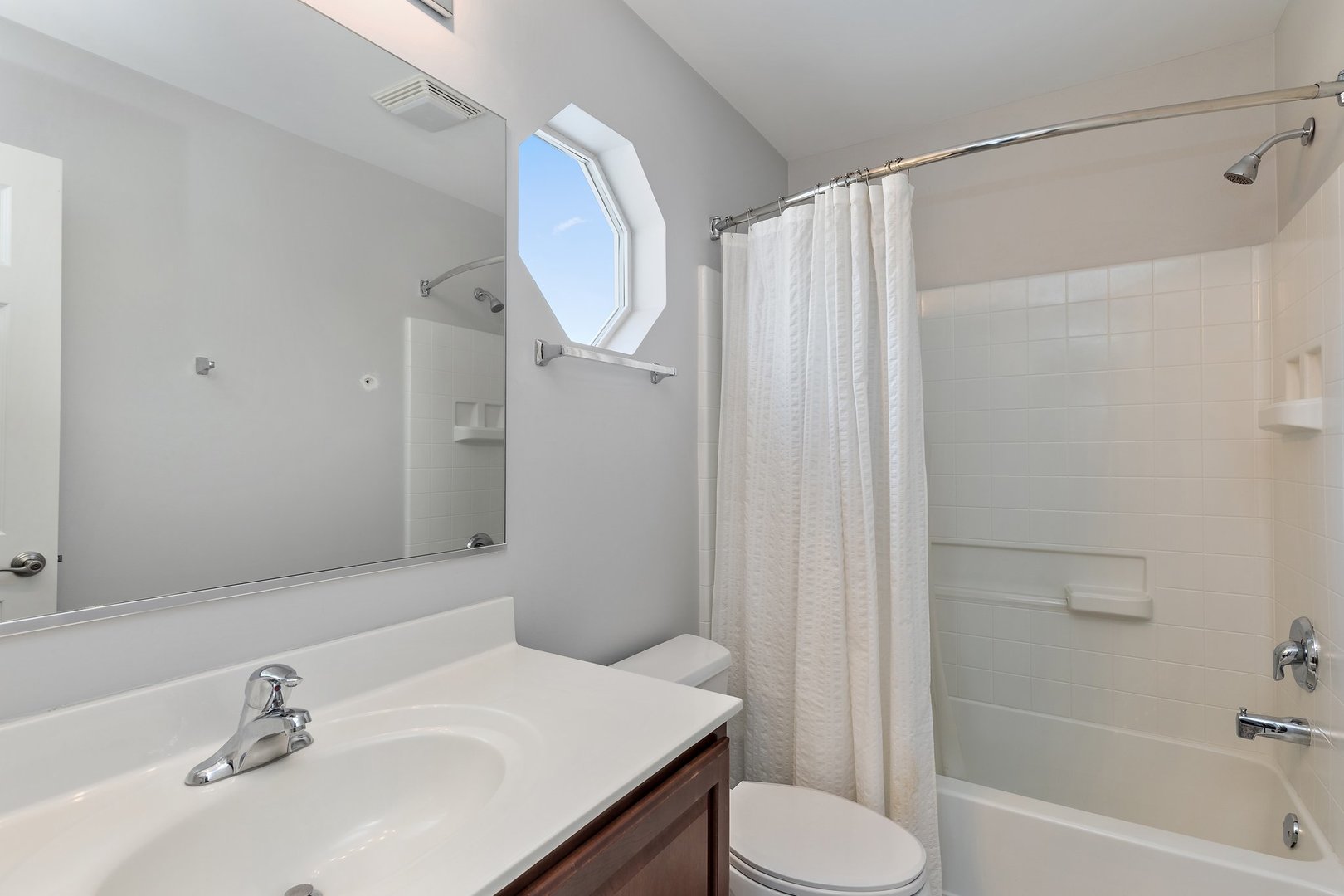 5617 Red Oak Drive Hoffman Estates, IL 60192 - Photo 20 of 30 a bathroom with a sink toilet and shower