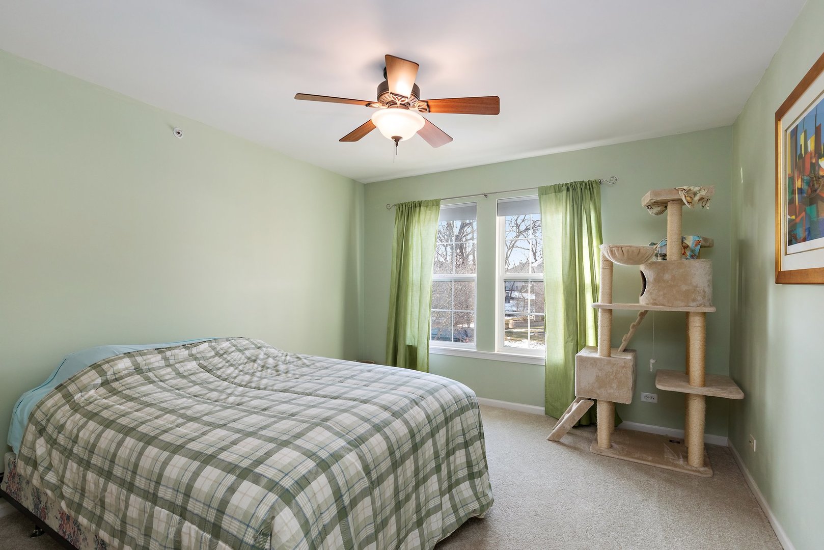 5617 Red Oak Drive Hoffman Estates, IL 60192 - Photo 21 of 30 a bedroom with a bed and a chandelier