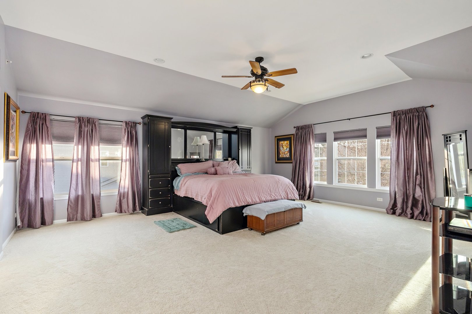 5617 Red Oak Drive Hoffman Estates, IL 60192 - Photo 22 of 30 a spacious bedroom with a large bed and a window