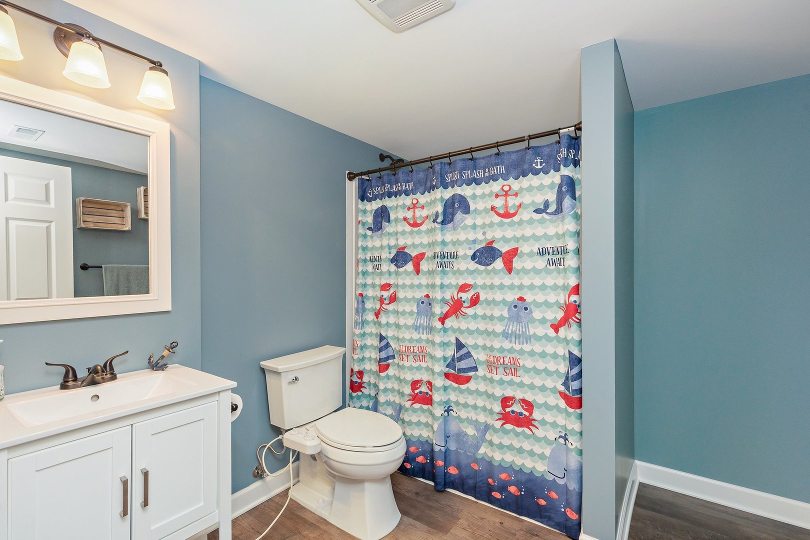 5617 Red Oak Drive Hoffman Estates, IL 60192 - Photo 27 of 30 a bathroom with a sink toilet vanity and window