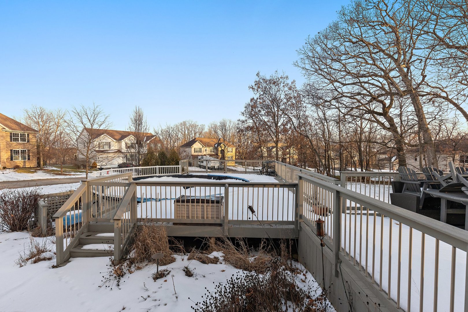 5617 Red Oak Drive Hoffman Estates, IL 60192 - Photo 30 of 30 a view of a roof deck with couches and wooden fence