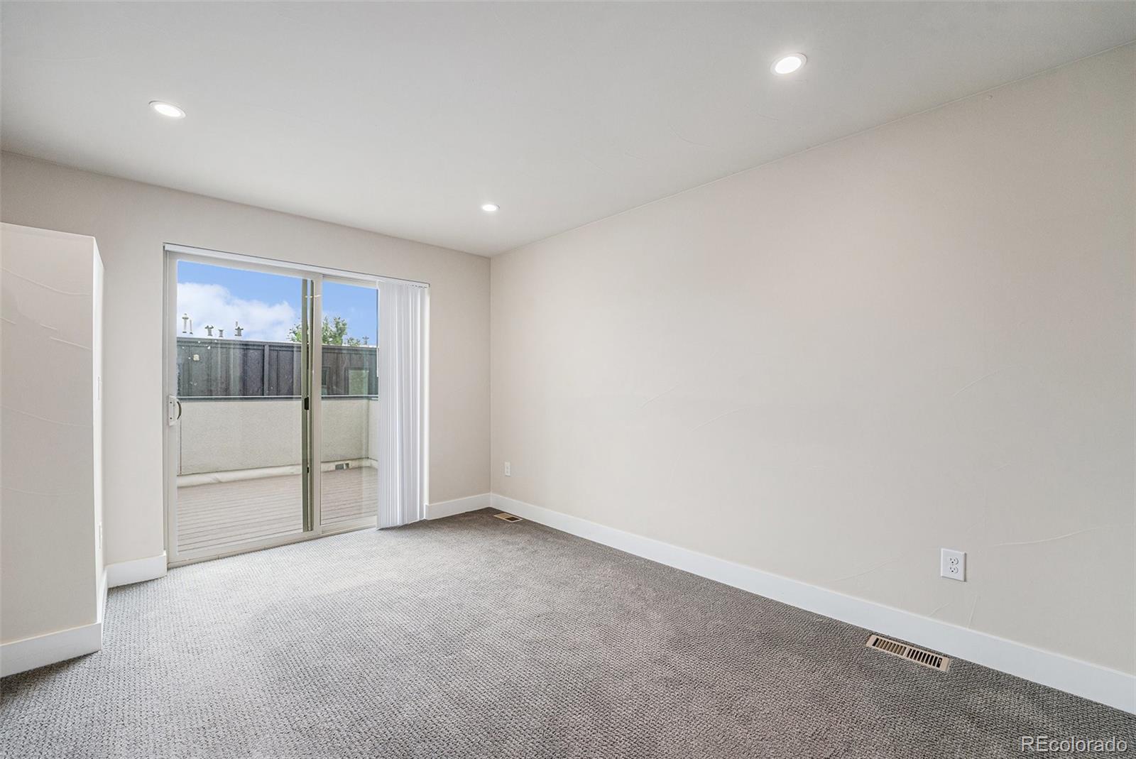 409 Harrison Street, Unit 2 Denver, CO 80206 - Photo 11 of 19 a view of an empty room with glass door