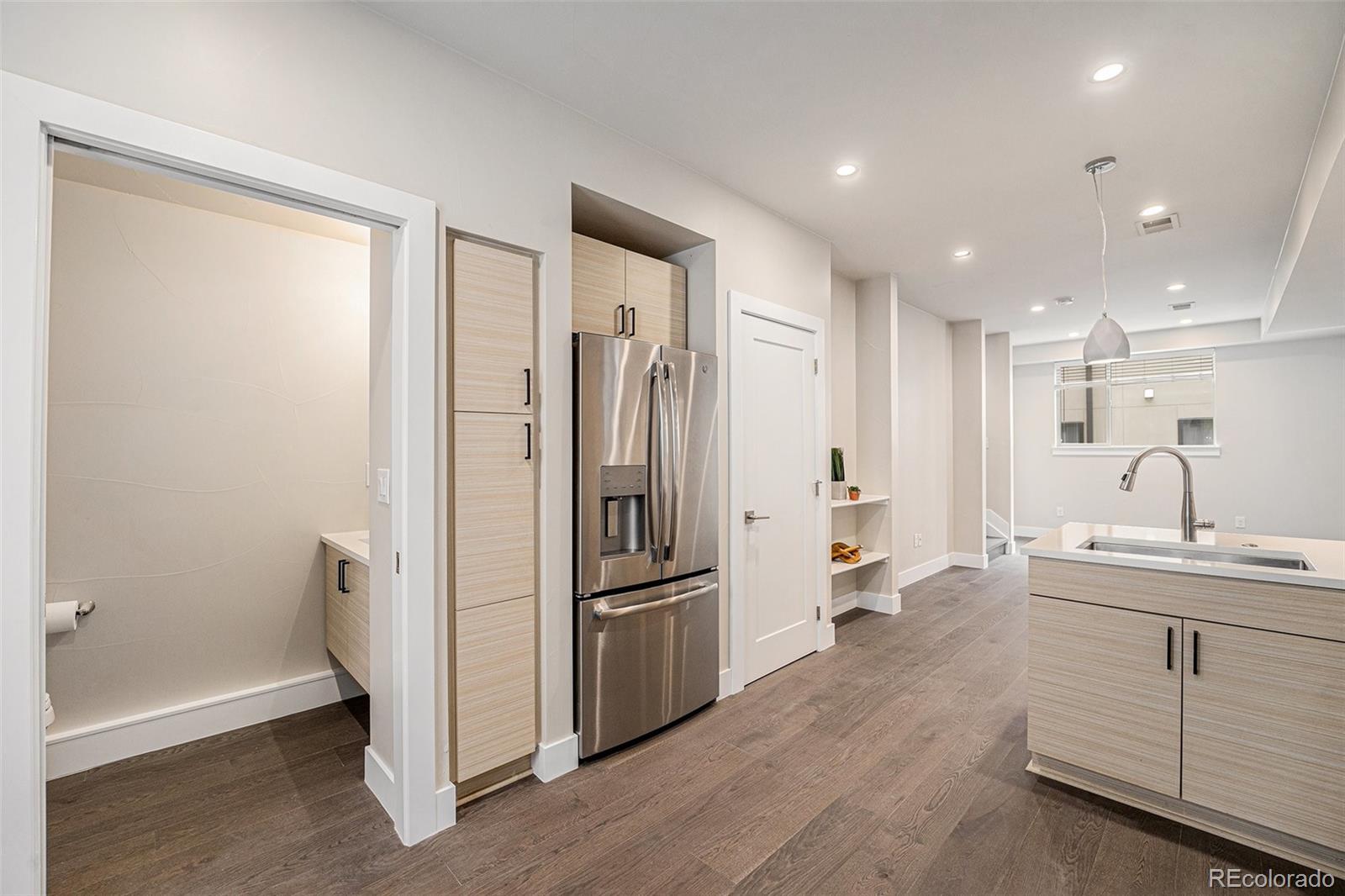 409 Harrison Street, Unit 2 Denver, CO 80206 - Photo 15 of 19 a kitchen with a refrigerator and white sink