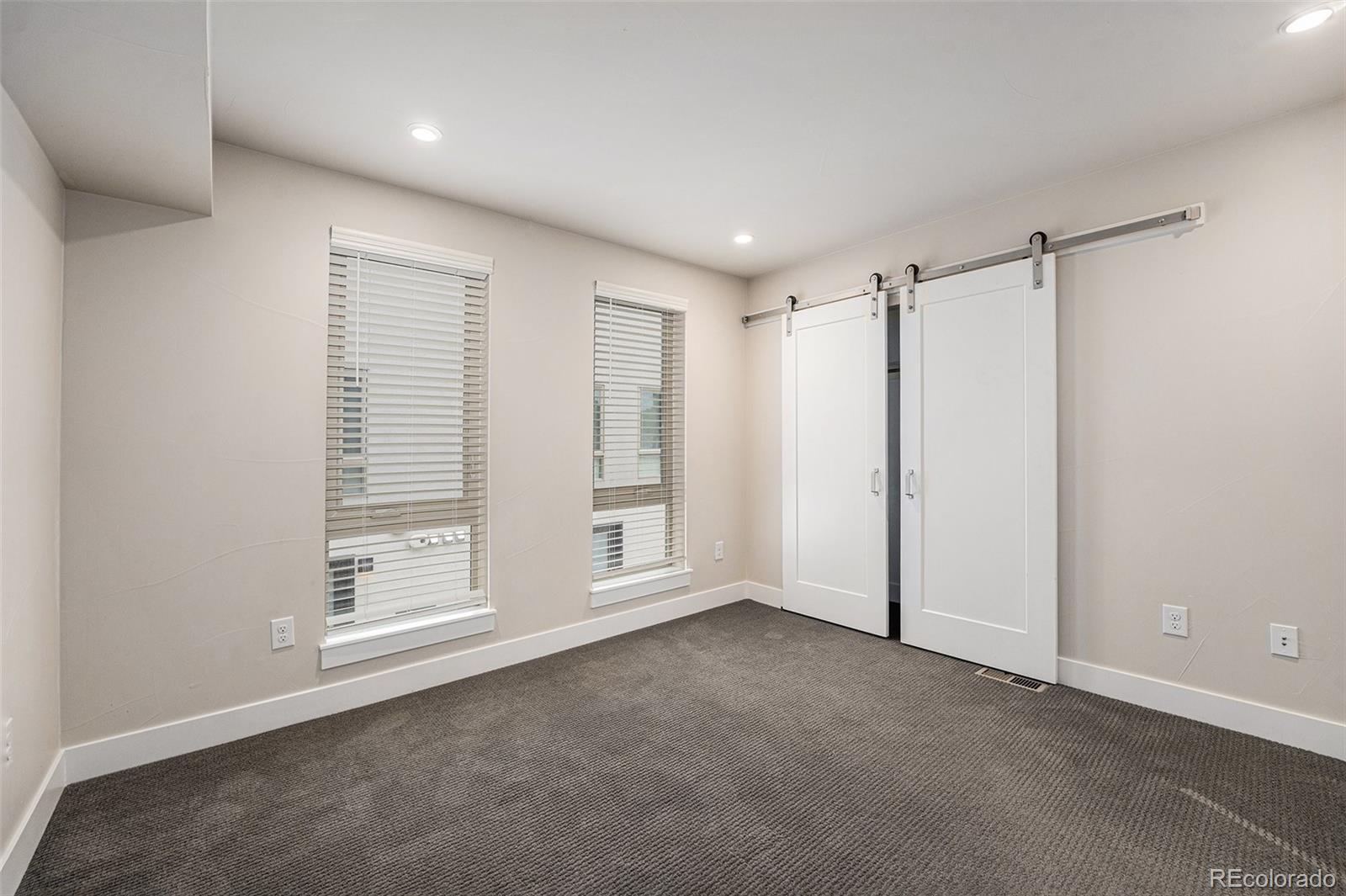 409 Harrison Street, Unit 2 Denver, CO 80206 - Photo 16 of 19 a view of an empty room with a window