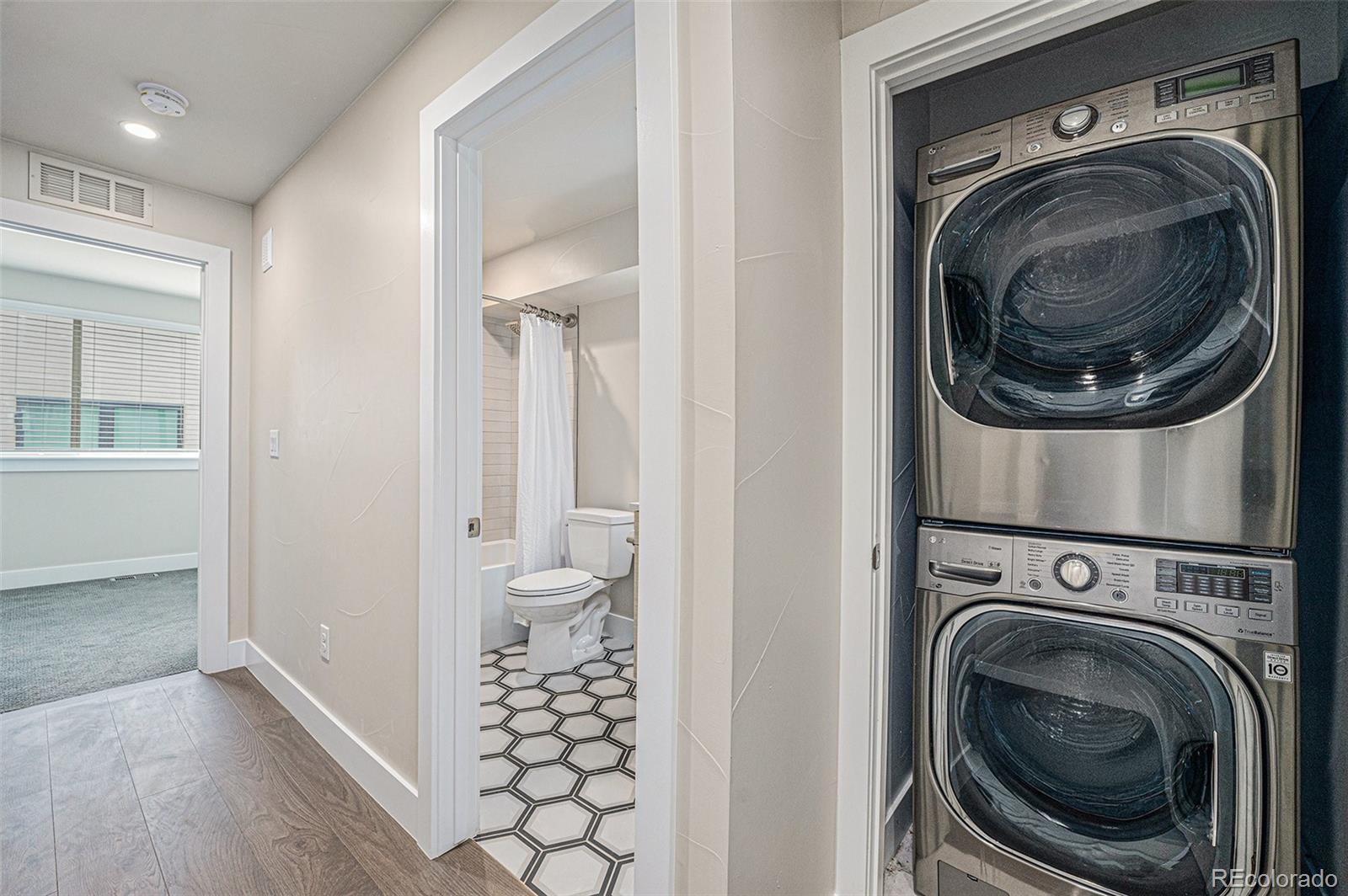 409 Harrison Street, Unit 2 Denver, CO 80206 - Photo 10 of 19 a view of a hallway with washer and dryer