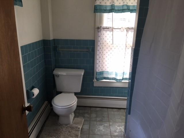 20 Continental Road Cornwall, NY 12518 - Photo 17 of 19 a bathroom with a toilet and a shower curtain