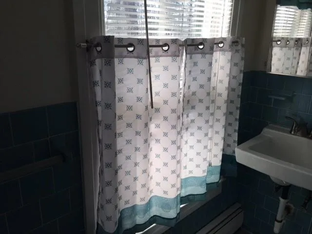 a bathroom with a bathtub and shower