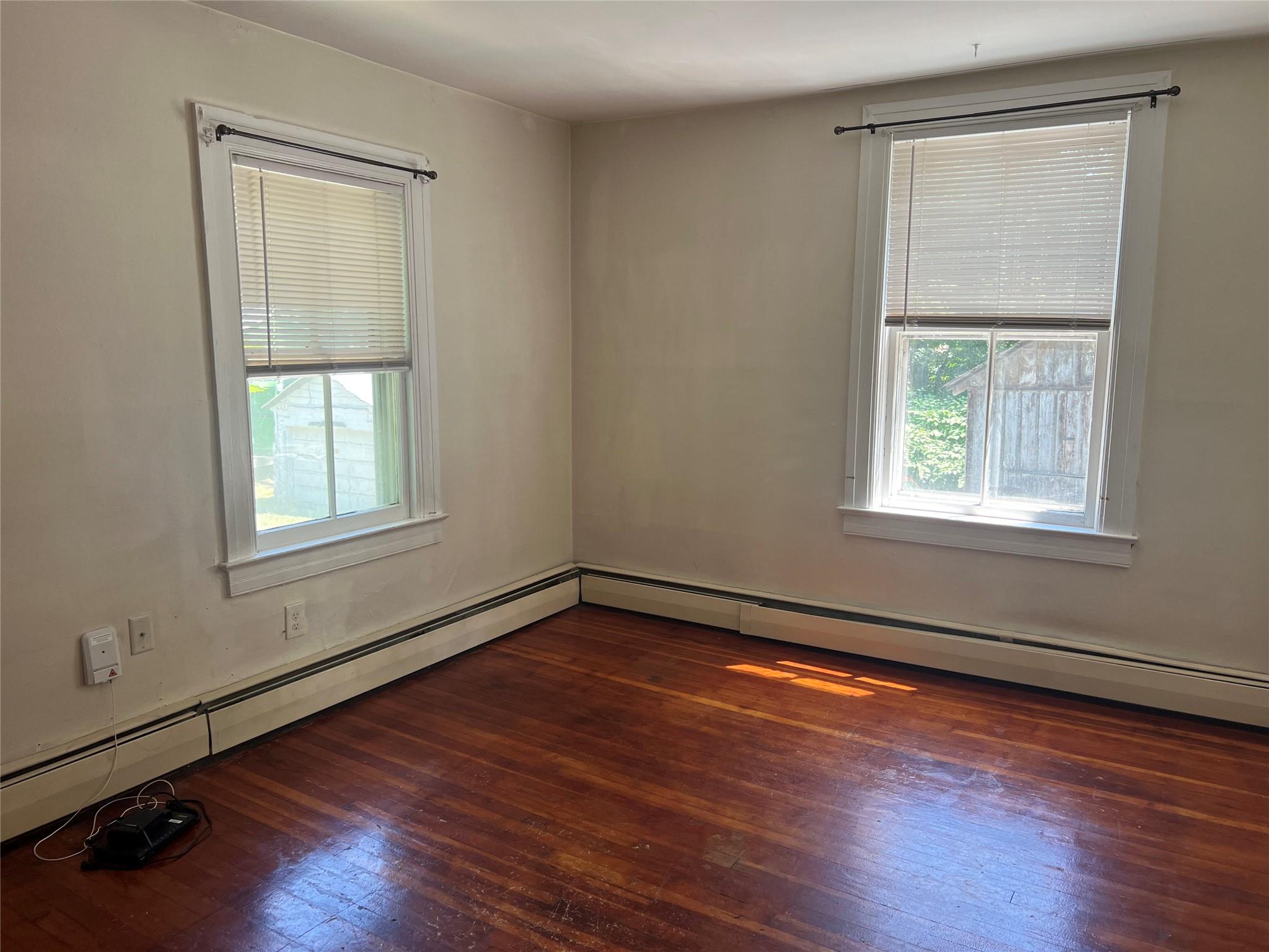 20 Continental Road Cornwall, NY 12518 - Photo 7 of 19 a view of an empty room with wooden floor and a window