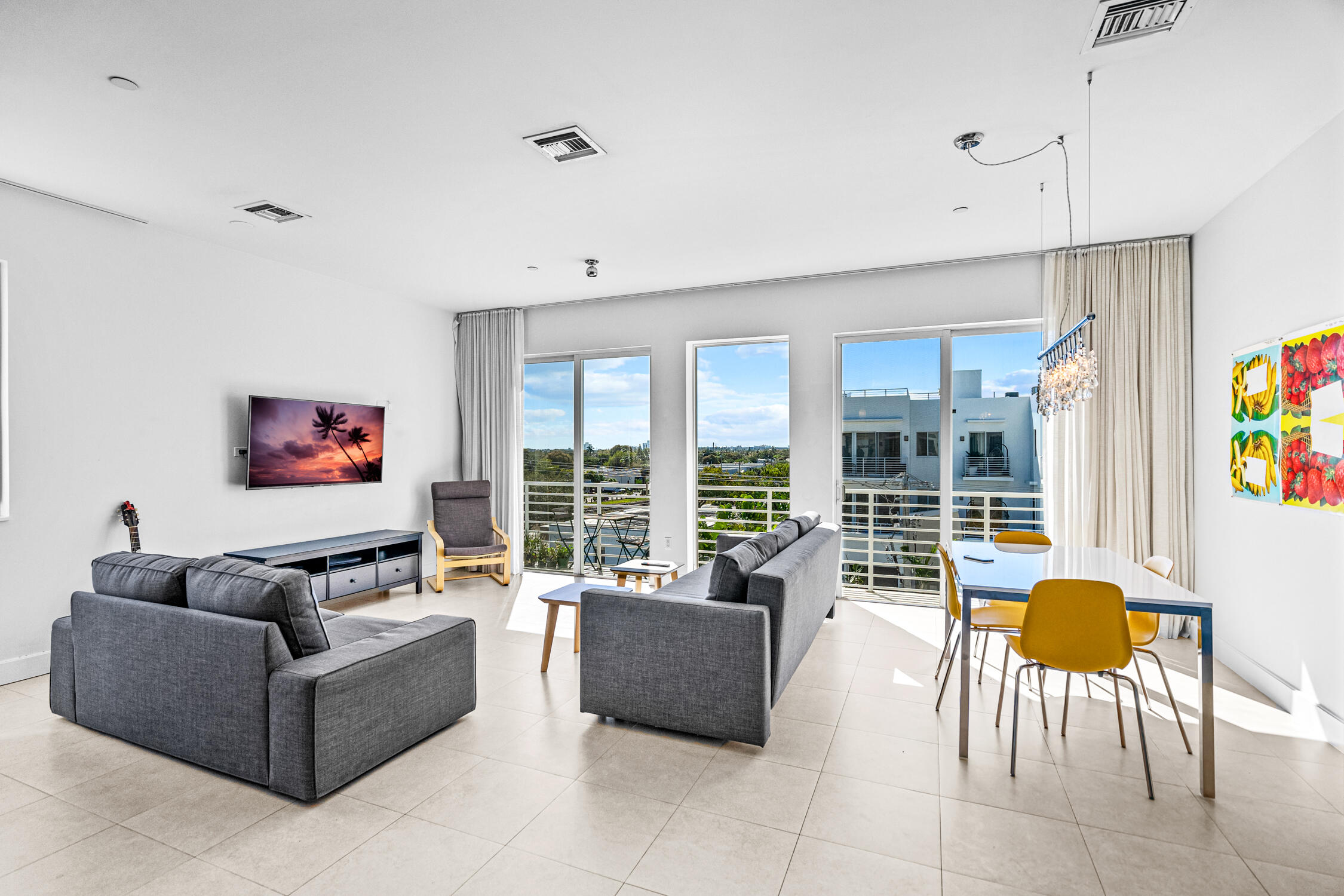 111 Southeast 2nd Street, Unit 401 Delray Beach, FL 33444 - Photo 16 of 38 a living room with furniture and a large window
