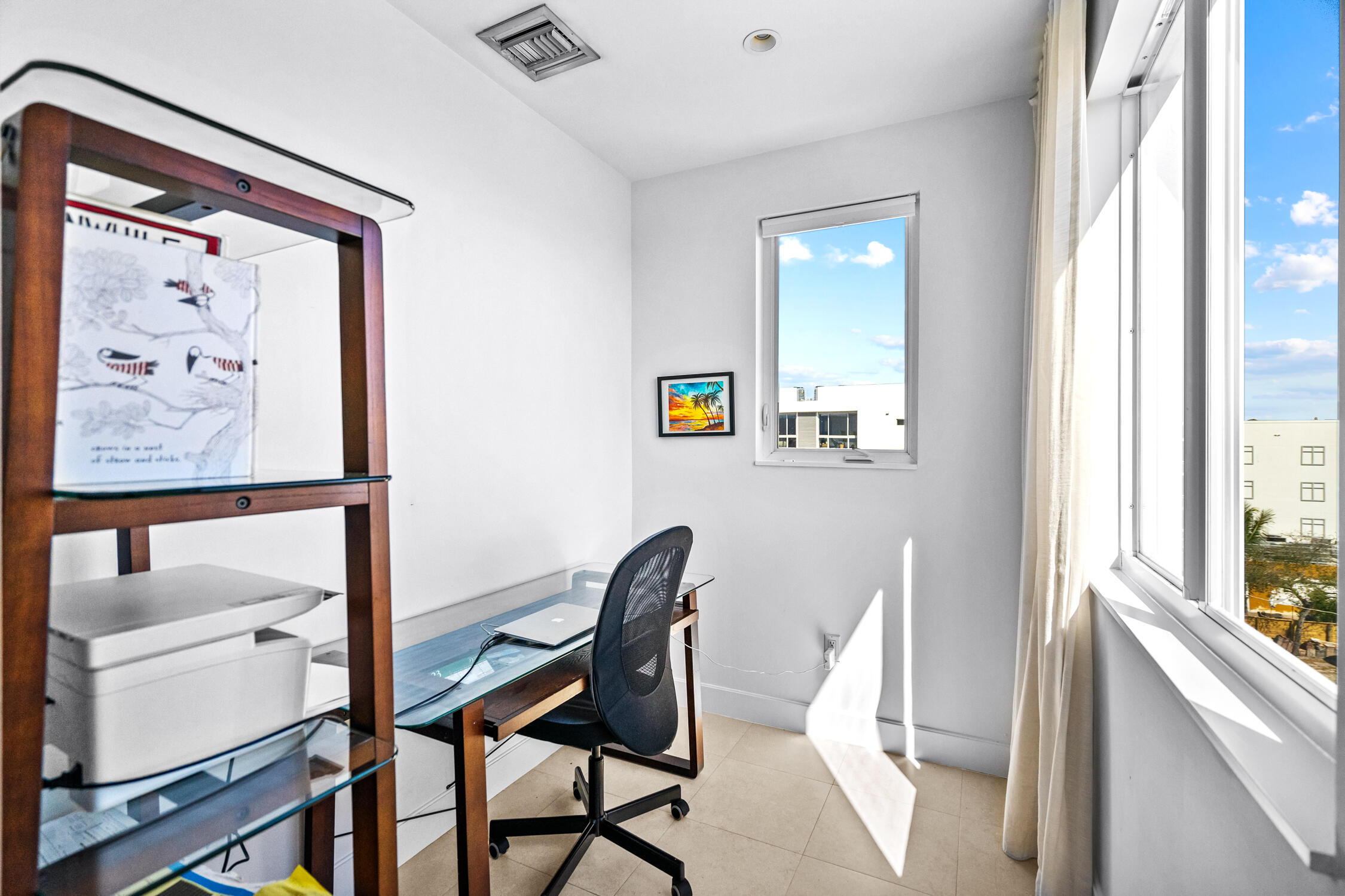 111 Southeast 2nd Street, Unit 401 Delray Beach, FL 33444 - Photo 19 of 38 a view of a hallway with furniture and a window