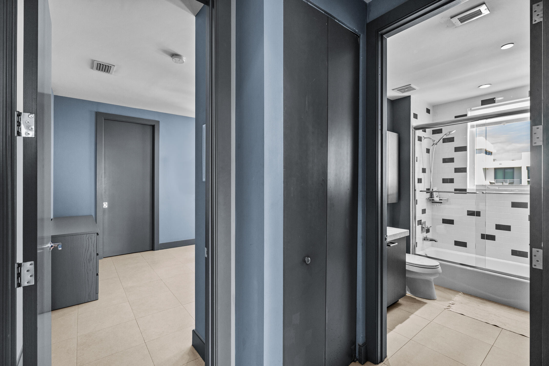 111 Southeast 2nd Street, Unit 401 Delray Beach, FL 33444 - Photo 24 of 38 a bathroom with a bathtub and a shower