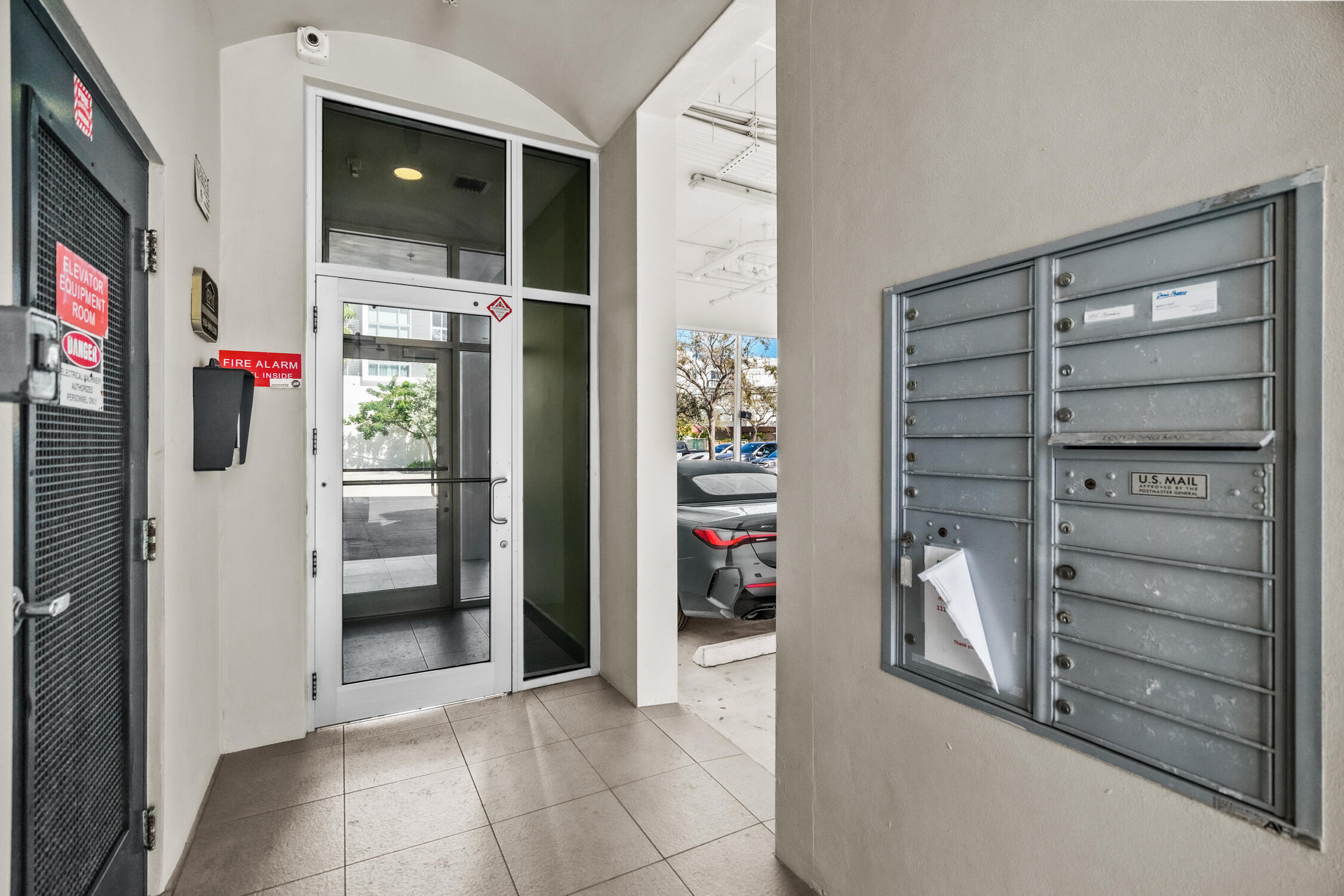 111 Southeast 2nd Street, Unit 401 Delray Beach, FL 33444 - Photo 30 of 38 a view of walk in closet with clothes and shoes