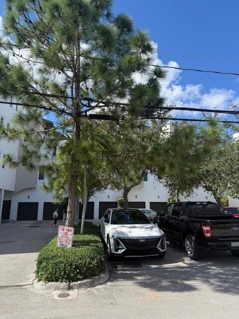 111 Southeast 2nd Street, Unit 401 Delray Beach, FL 33444 - Photo 38 of 38 a front view of a house with a yard