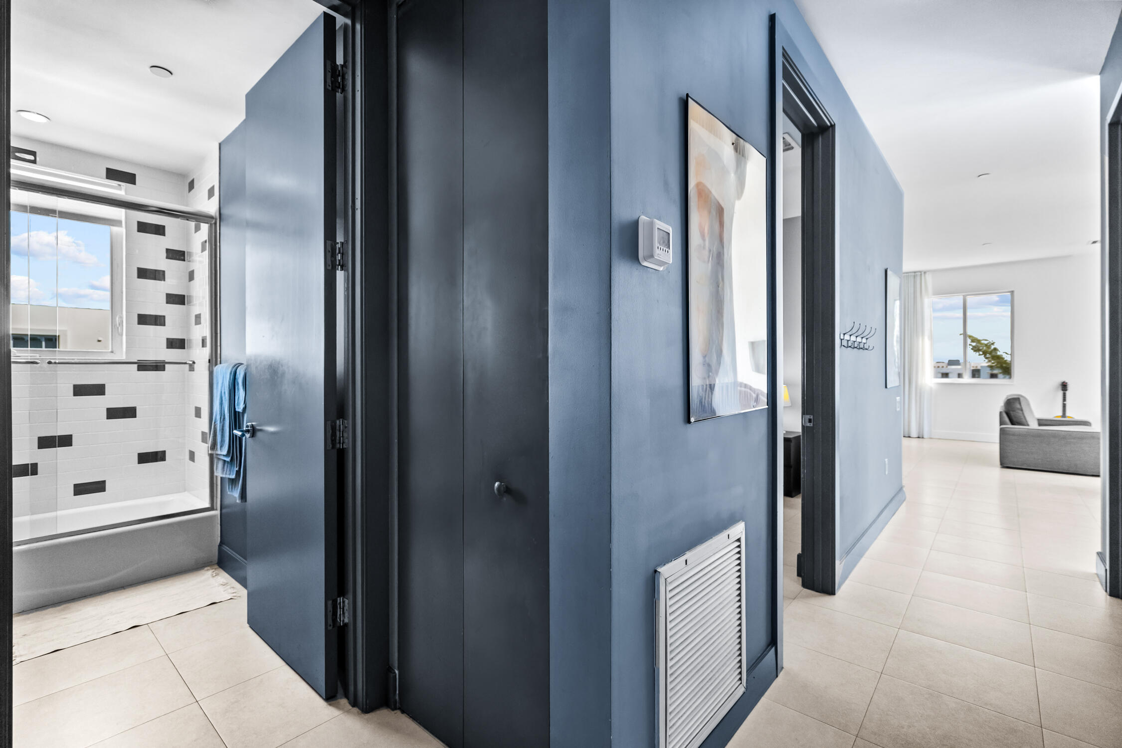 111 Southeast 2nd Street, Unit 401 Delray Beach, FL 33444 - Photo 9 of 38 a bathroom with a glass door shower