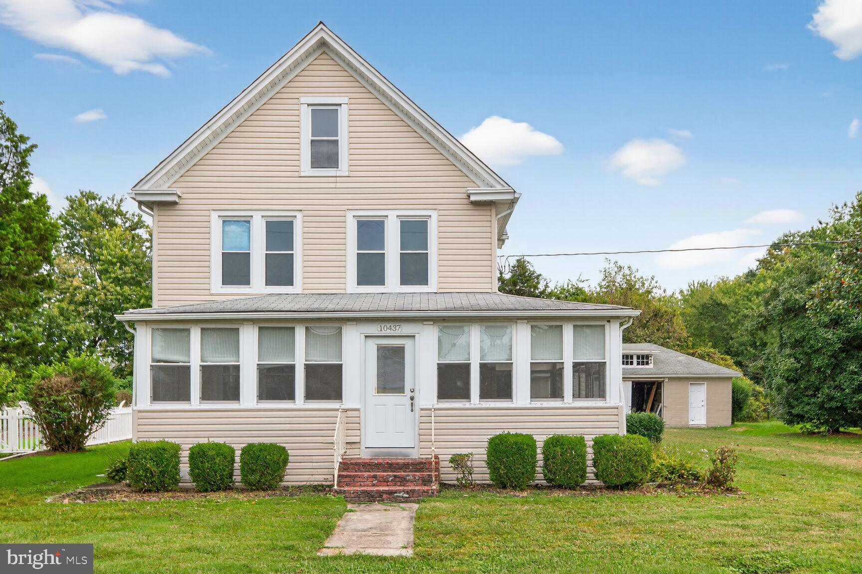 10437 Main Street Claiborne, MD 21624 - Photo 12 of 44 a front view of a house with a yard