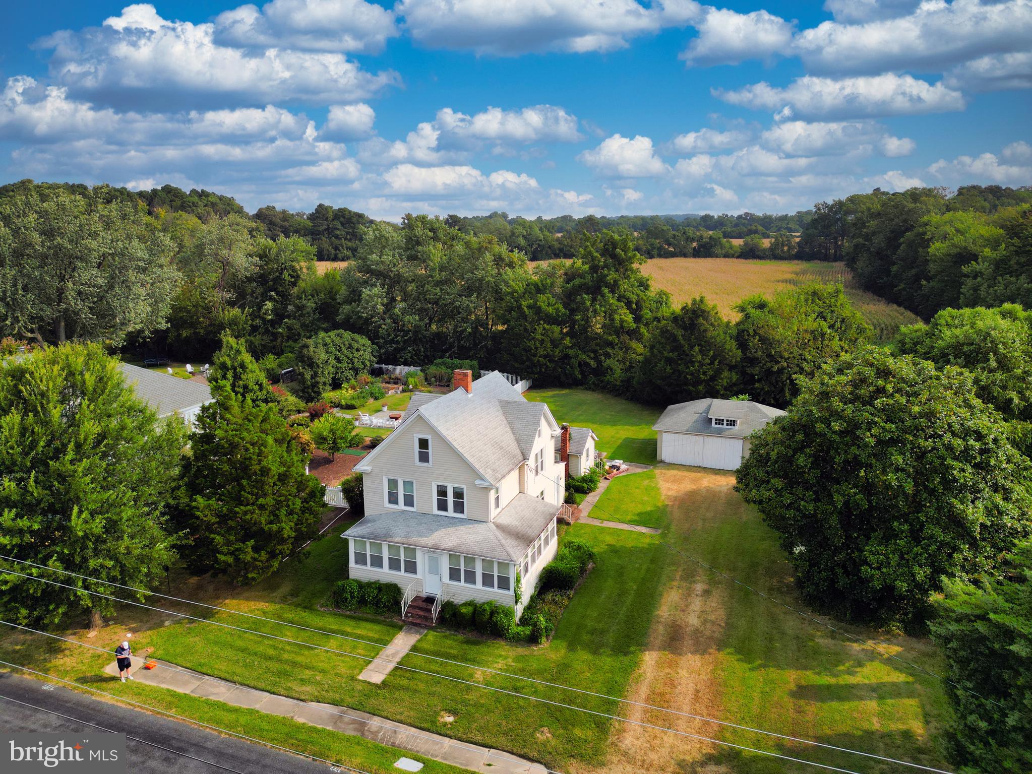 10437 Main Street Claiborne, MD 21624 - Photo 2 of 44 an aerial view of a house with a garden