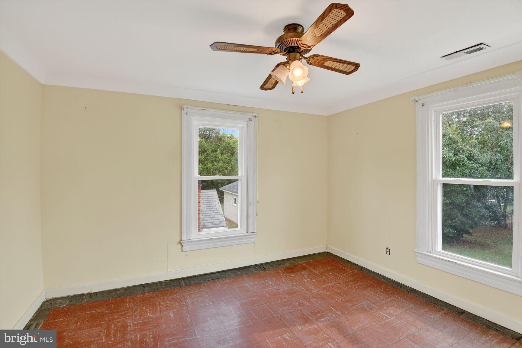 10437 Main Street Claiborne, MD 21624 - Photo 24 of 44 a view of room with a ceiling fan and window