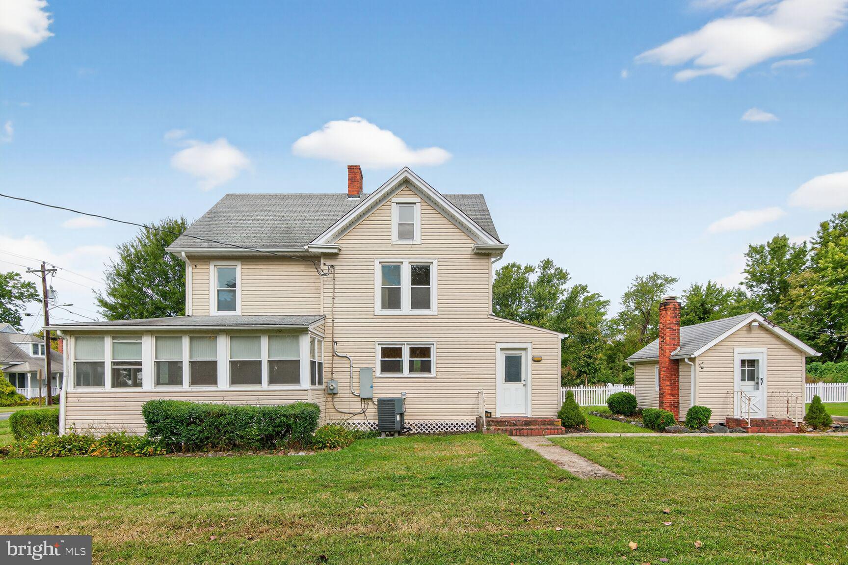 10437 Main Street Claiborne, MD 21624 - Photo 28 of 44 a view of a house with a yard