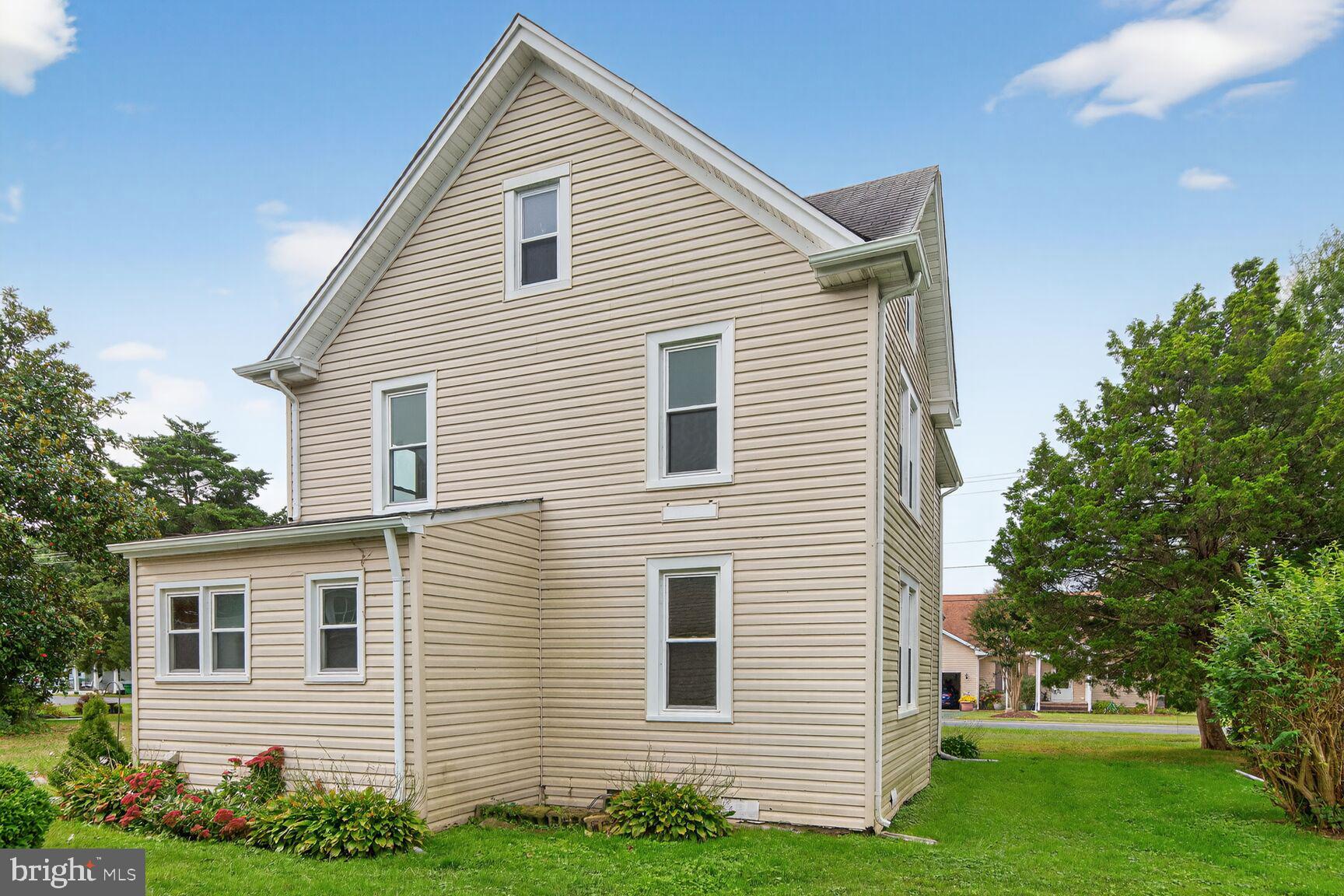 10437 Main Street Claiborne, MD 21624 - Photo 29 of 44 a view of a house with a yard