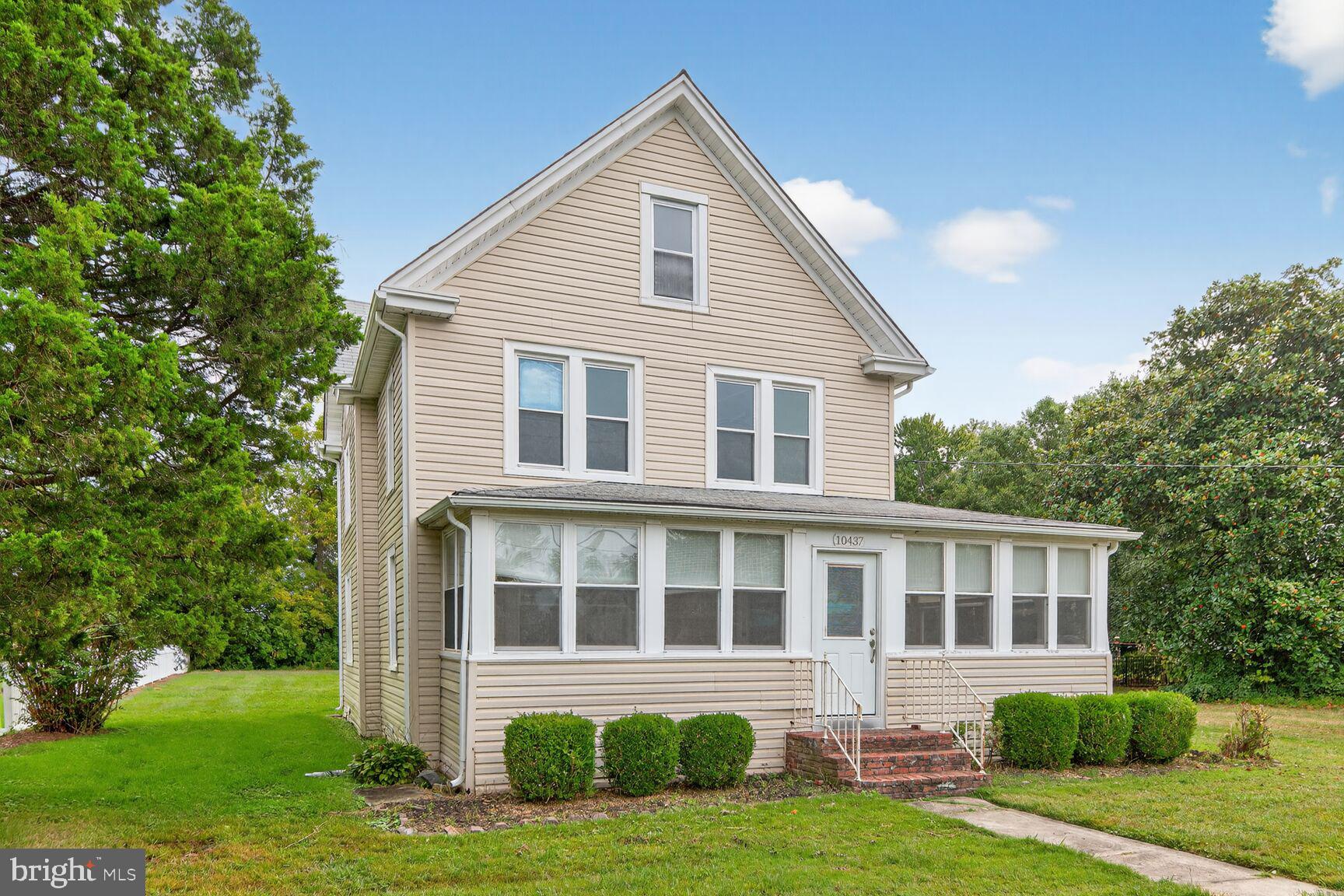 10437 Main Street Claiborne, MD 21624 - Photo 30 of 44 a front view of a house with a yard