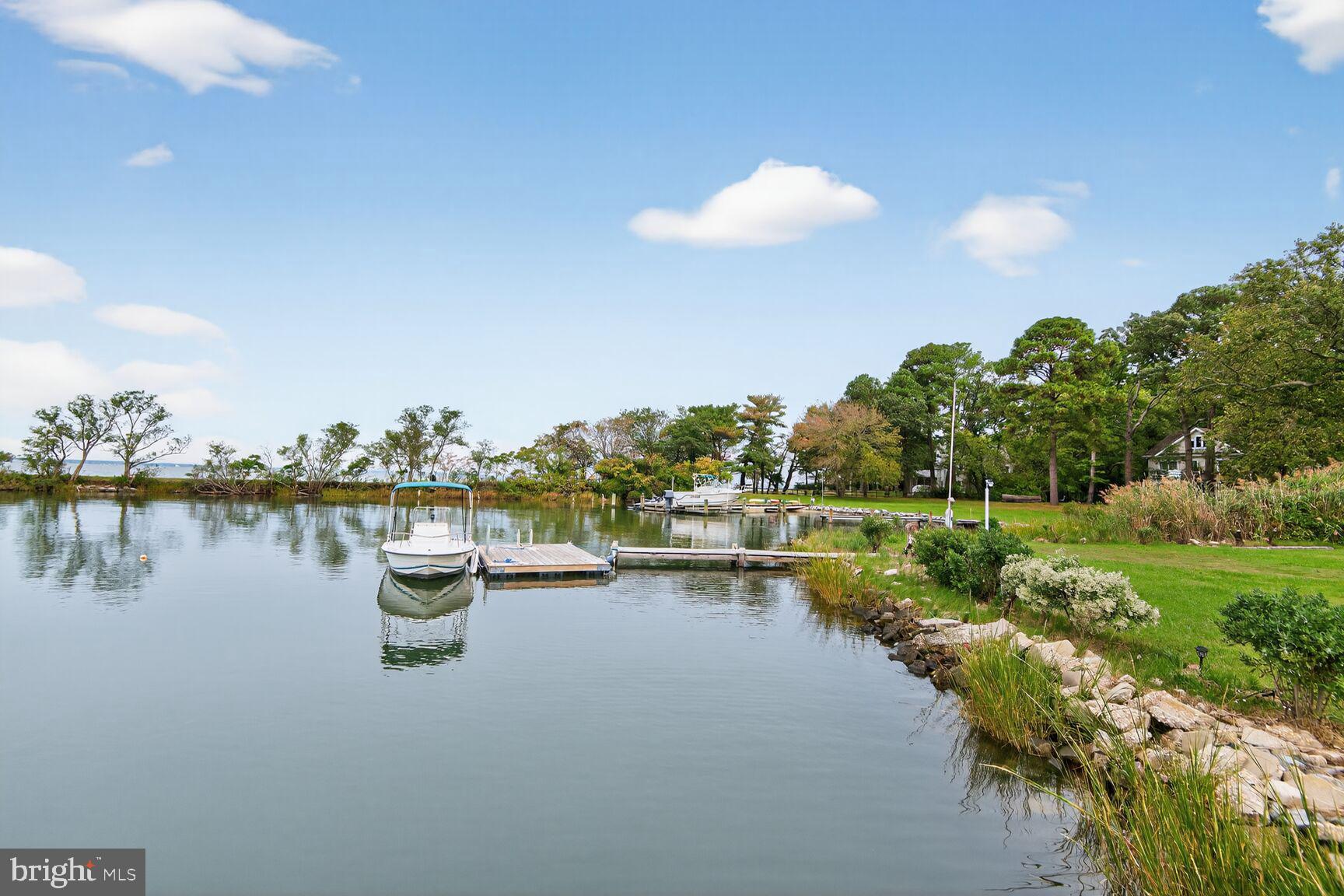 10437 Main Street Claiborne, MD 21624 - Photo 34 of 44 a view of a lake with houses