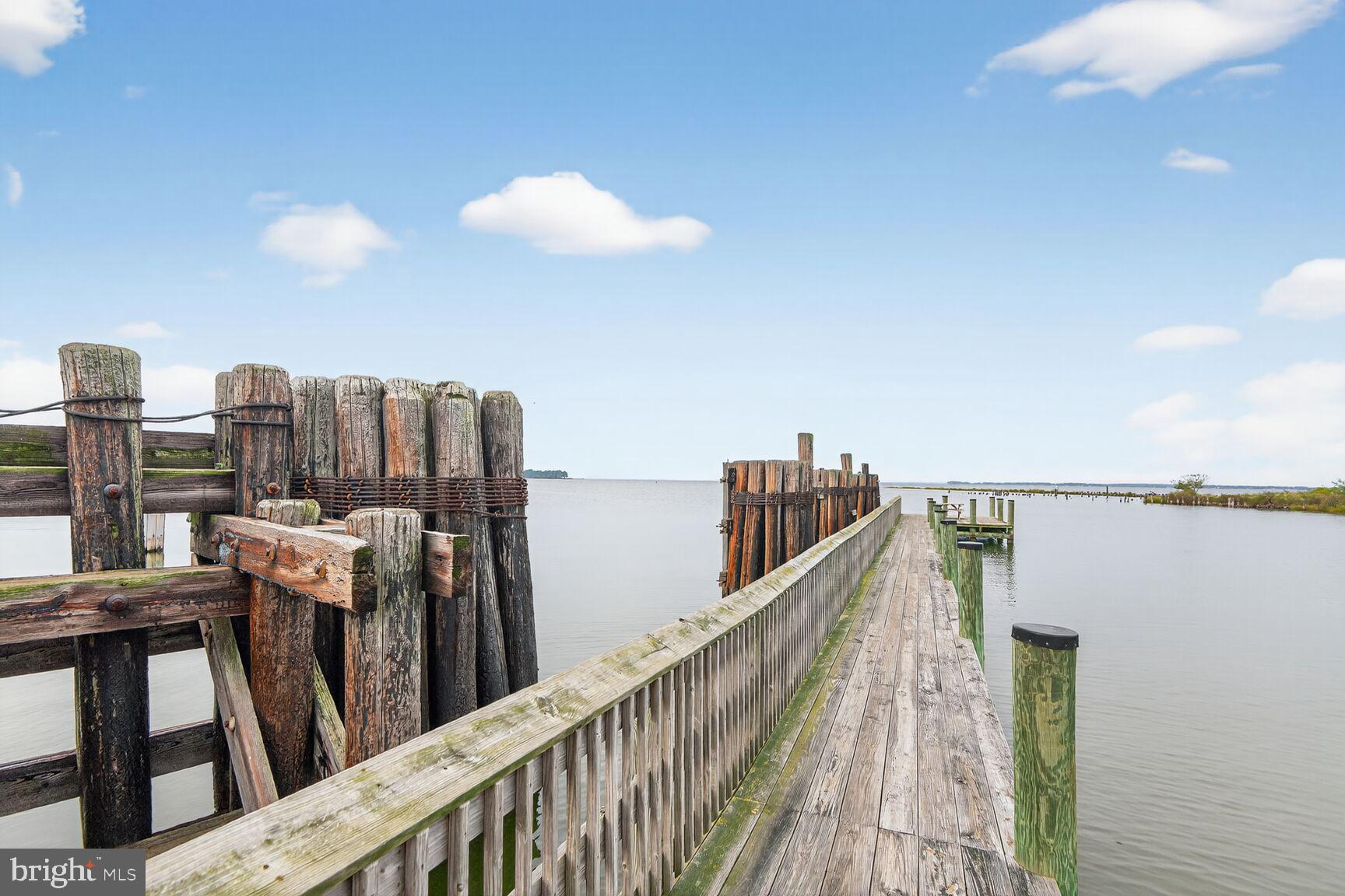 10437 Main Street Claiborne, MD 21624 - Photo 36 of 44 a view of a balcony with furniture