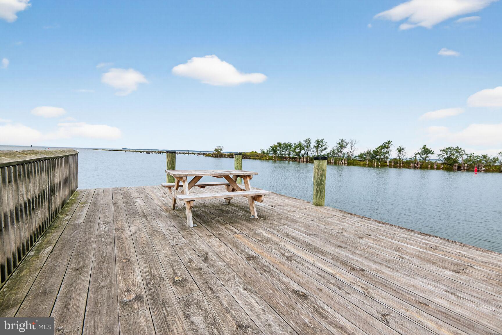 10437 Main Street Claiborne, MD 21624 - Photo 37 of 44 a view of a terrace with wooden floor and outdoor space