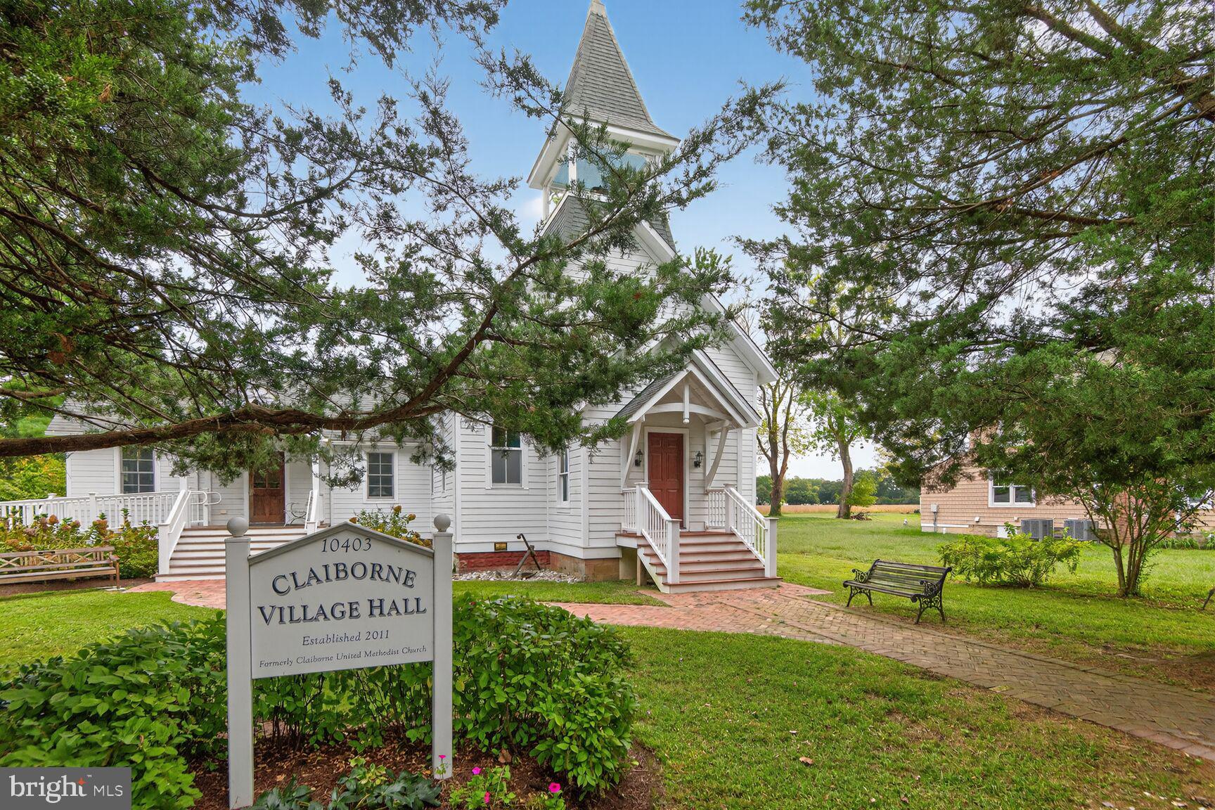 10437 Main Street Claiborne, MD 21624 - Photo 39 of 44 a sign on the side of a building