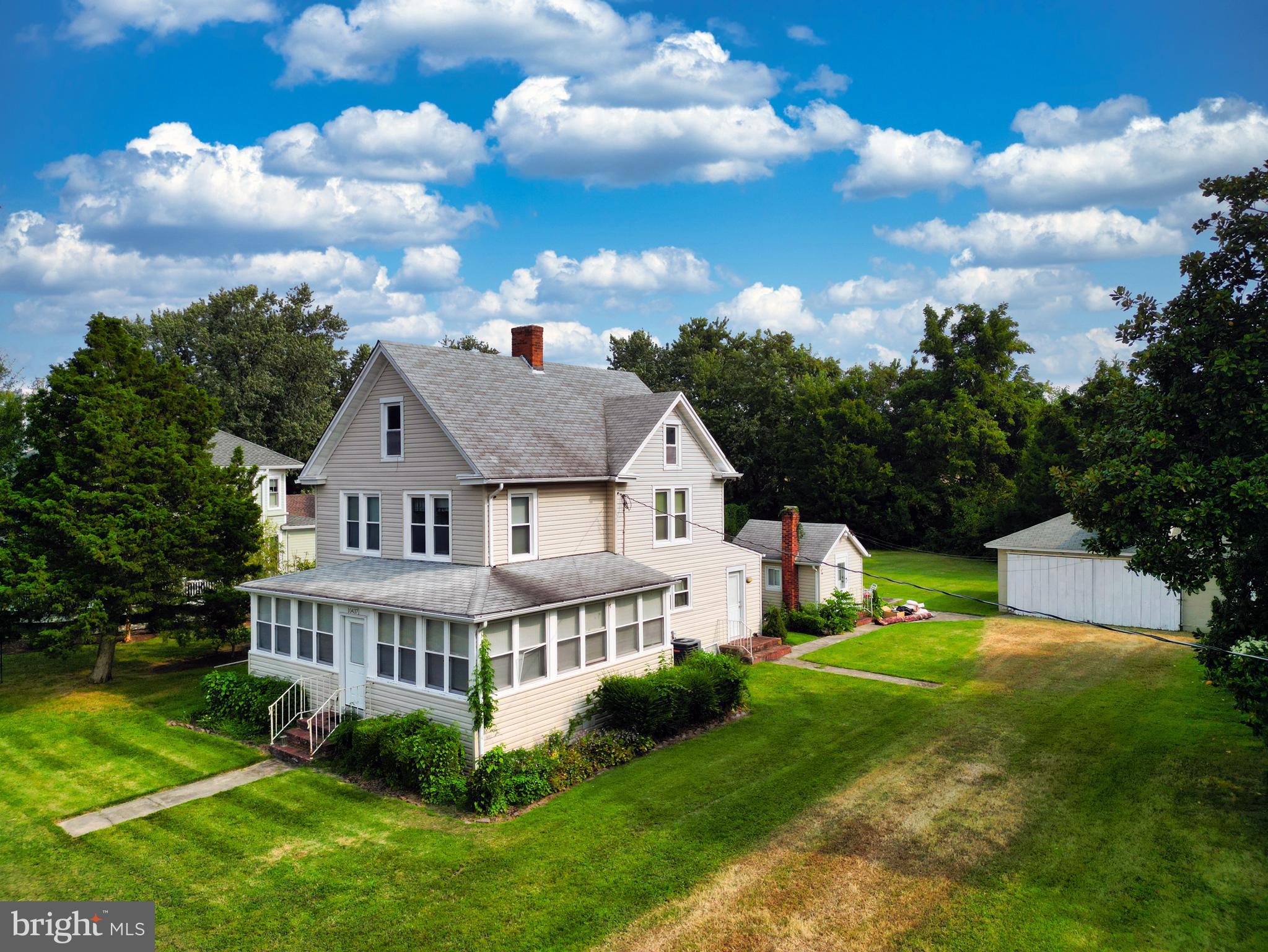 10437 Main Street Claiborne, MD 21624 - Photo 10 of 44 a view of a house with a big yard and potted plants