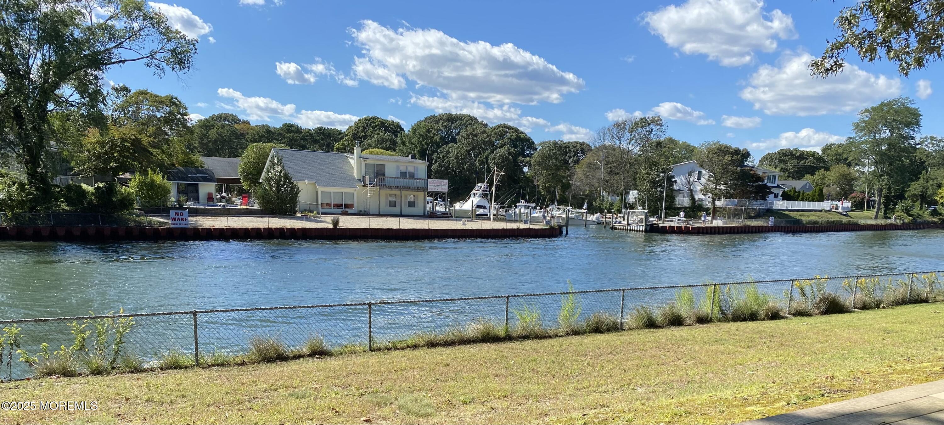 1501 Hulse Road, Unit 13 Point Pleasant, NJ 08742 - Photo 2 of 9 a view of a lake with houses