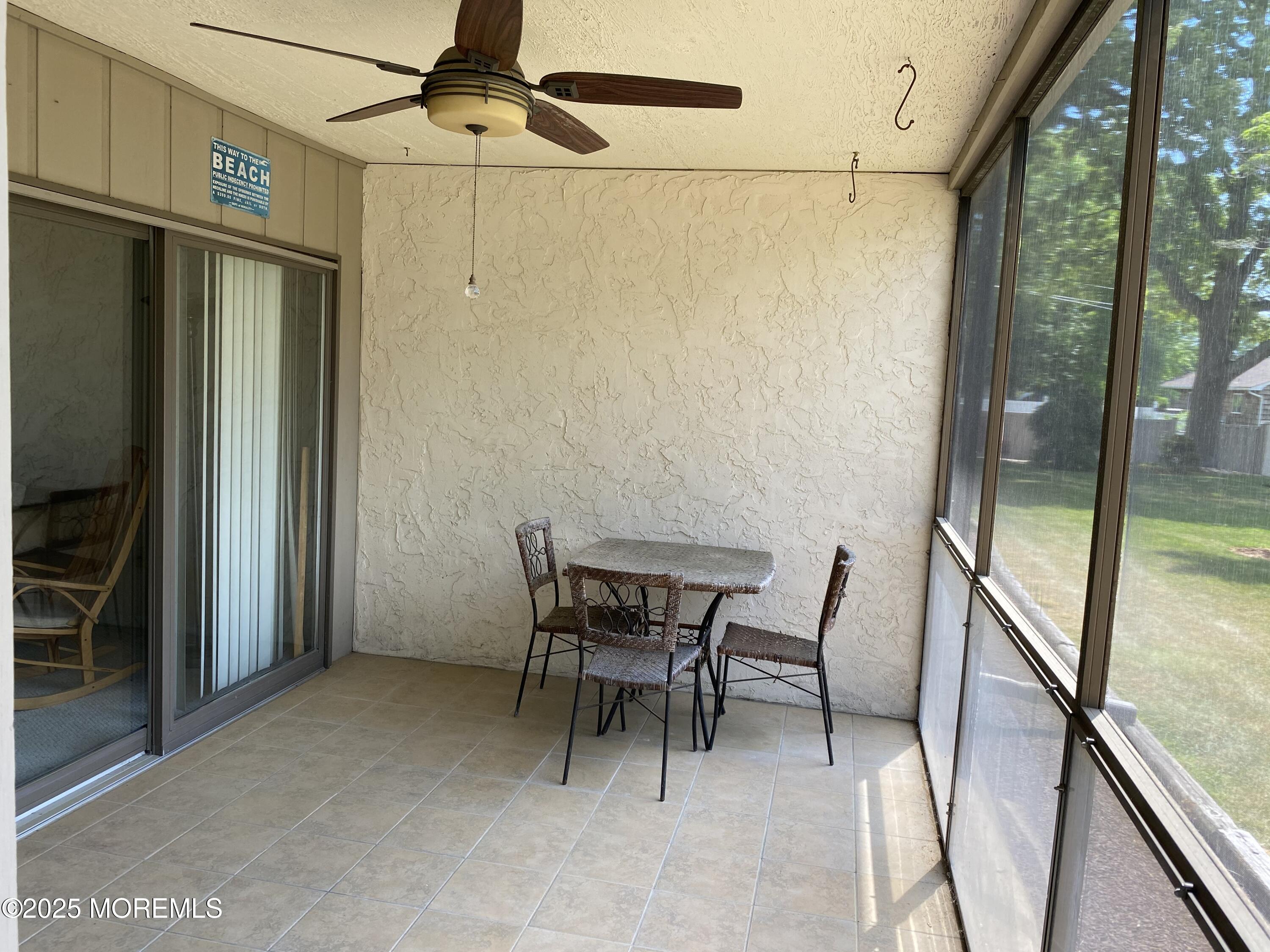 1501 Hulse Road, Unit 13 Point Pleasant, NJ 08742 - Photo 3 of 9 a view of a hallway with furniture and front door