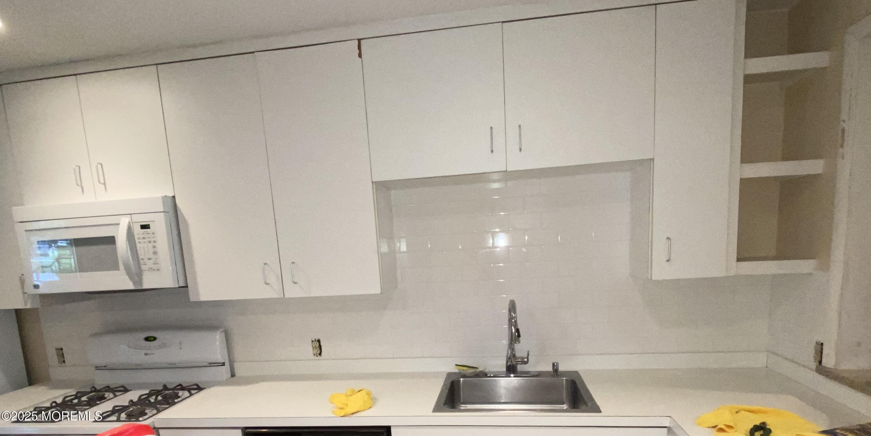 1501 Hulse Road, Unit 13 Point Pleasant, NJ 08742 - Photo 4 of 9 a kitchen with a sink and cabinets