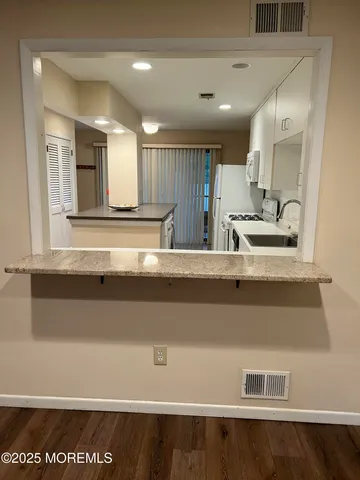 a view of kitchen with counter top space