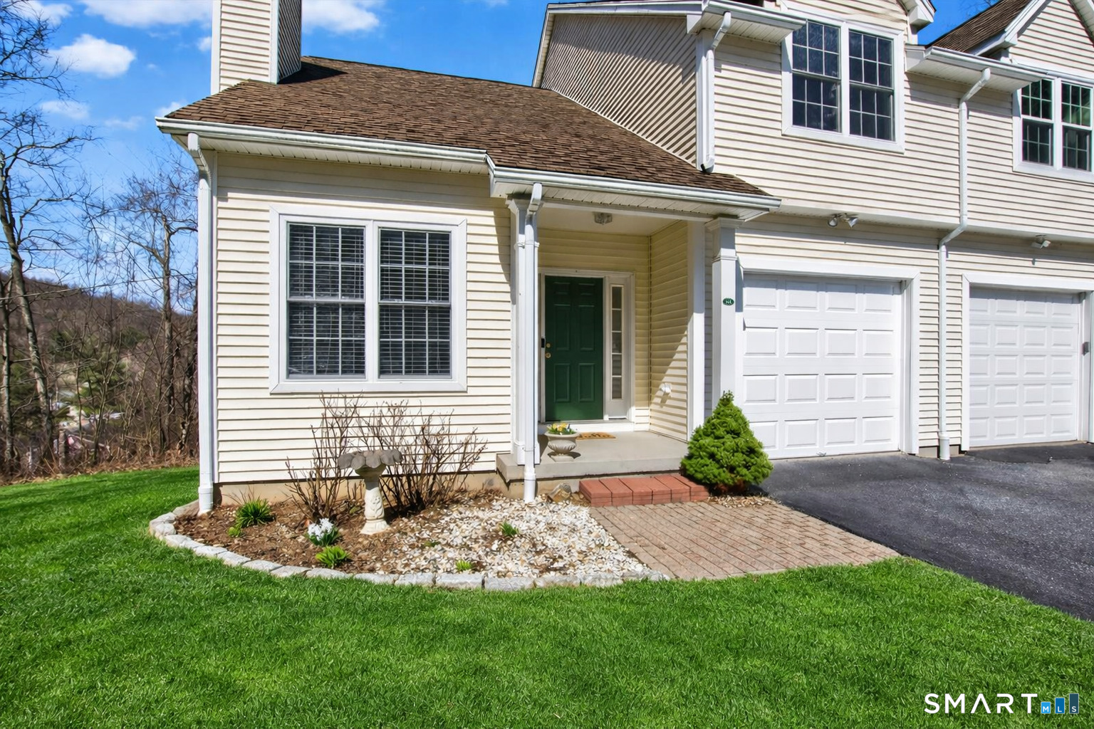 16 A Claire Hill Road Burlington, CT 06013 - Photo 1 of 37 a front view of a house with a yard and garage
