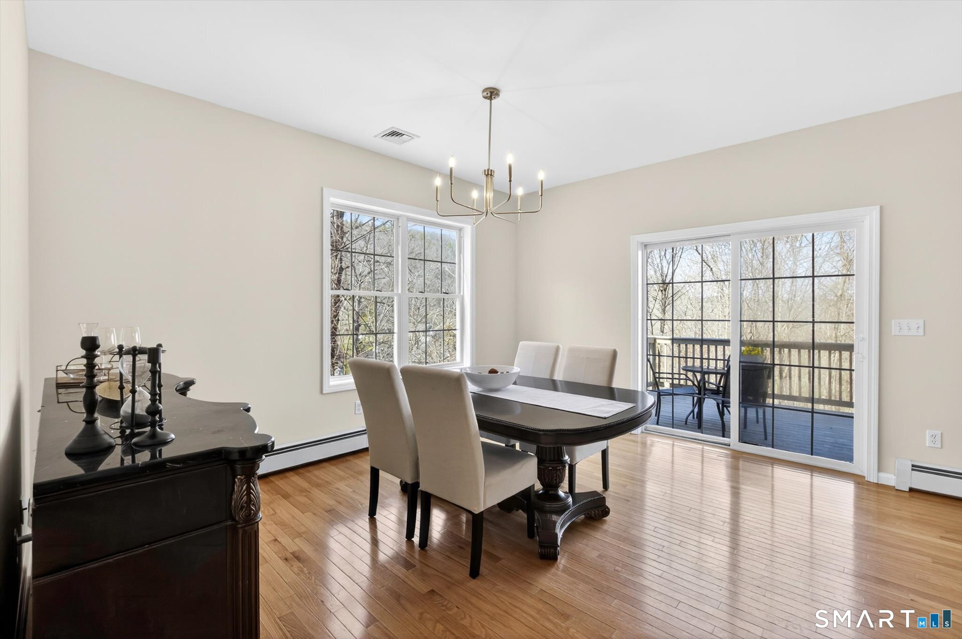 16 A Claire Hill Road Burlington, CT 06013 - Photo 14 of 37 a view of a dining room with furniture window and wooden floor