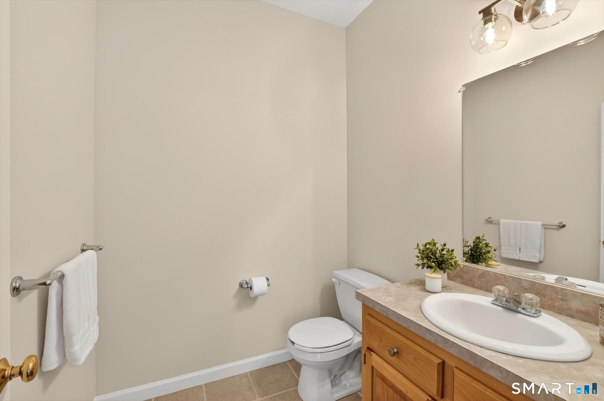 16 A Claire Hill Road Burlington, CT 06013 - Photo 19 of 37 a bathroom with a sink toilet and a mirror