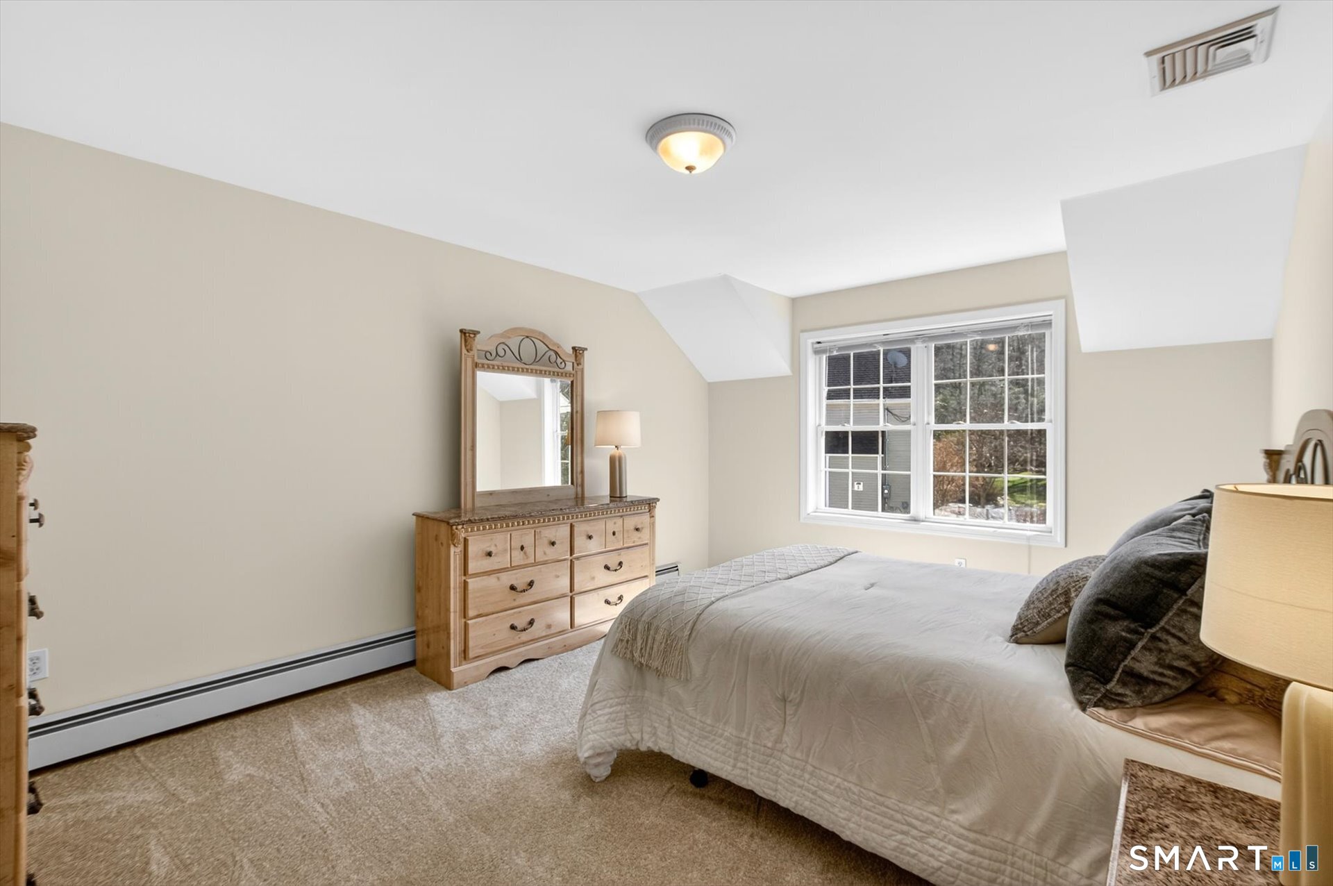 16 A Claire Hill Road Burlington, CT 06013 - Photo 24 of 37 a bedroom with a bed and a window with chair