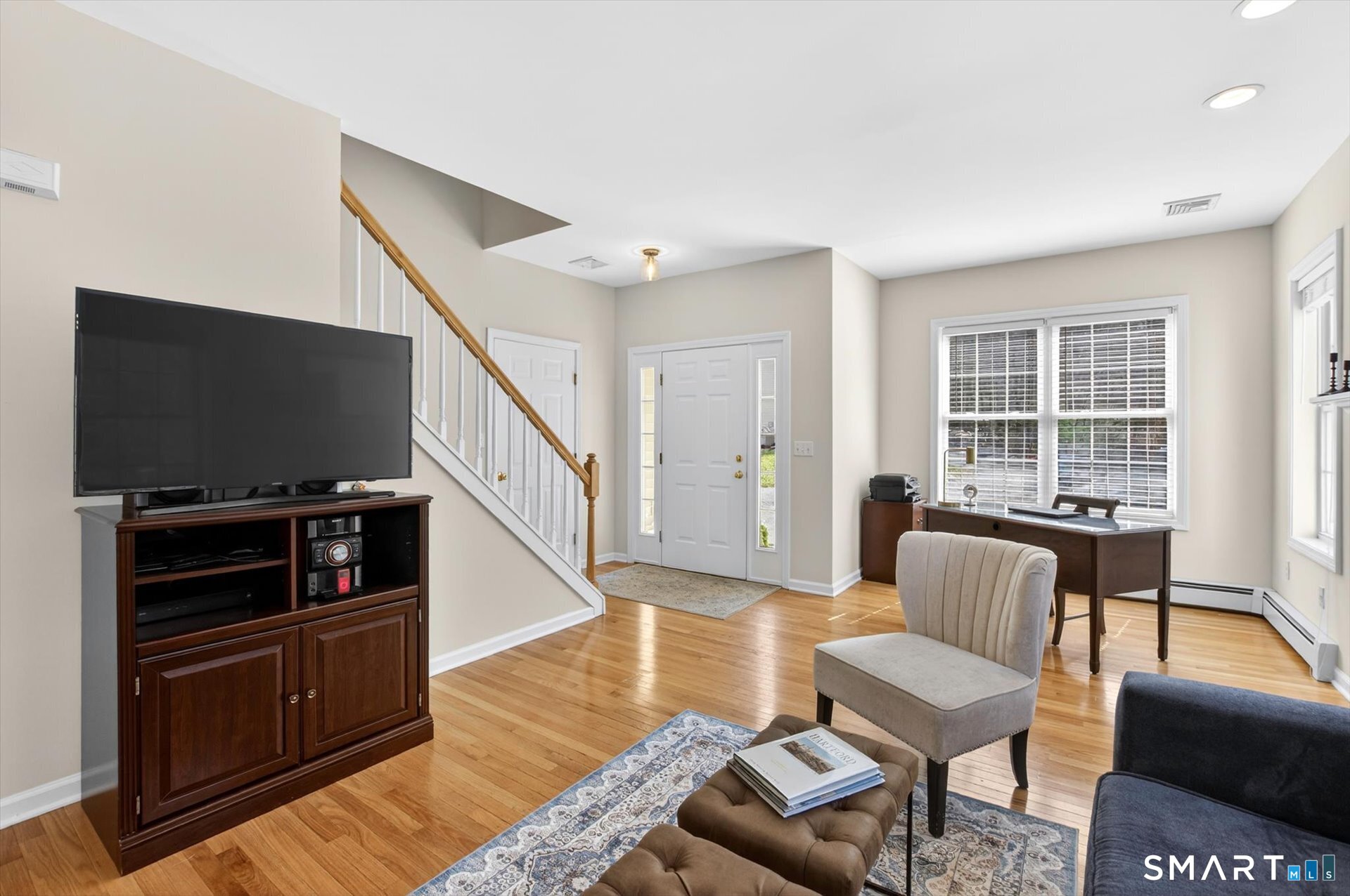 16 A Claire Hill Road Burlington, CT 06013 - Photo 5 of 37 a living room with furniture and a flat screen tv