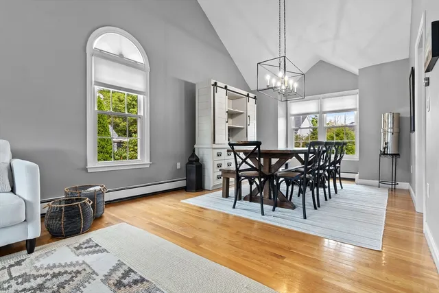 a view of a dining room with furniture window and wooden floor
